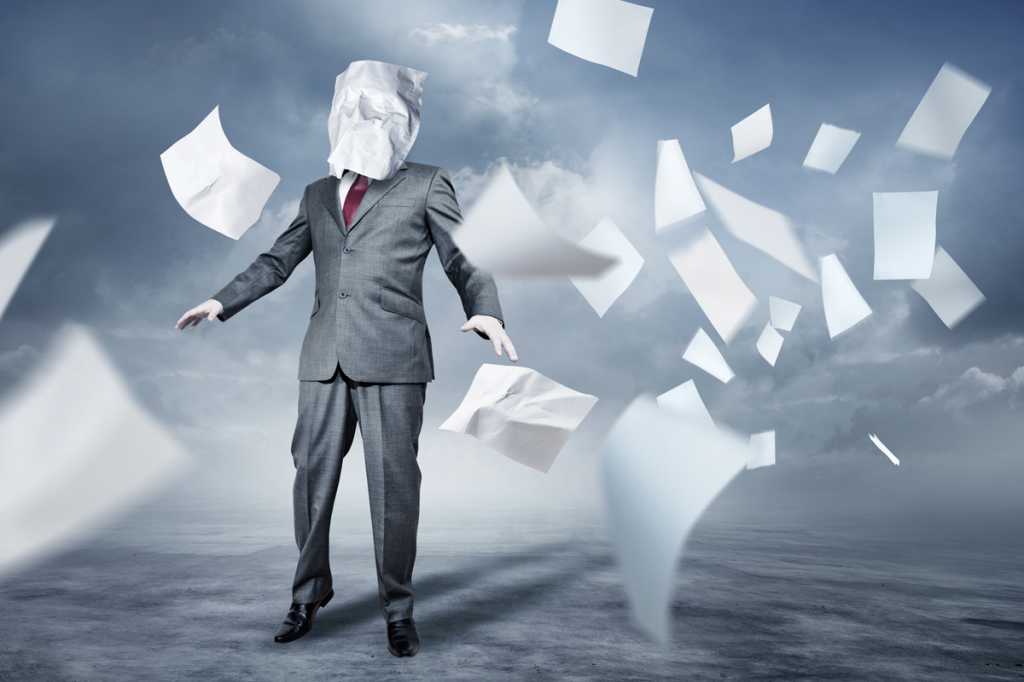 overwhelmed businessman flying papers information overload tornado